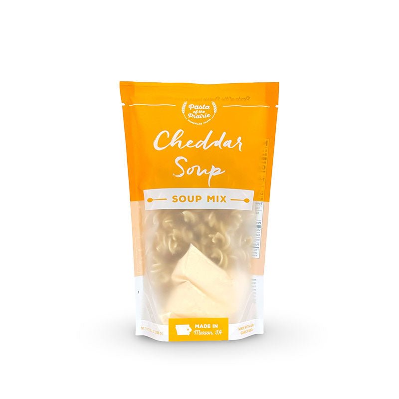 Package of cheddar soup mix on a white background