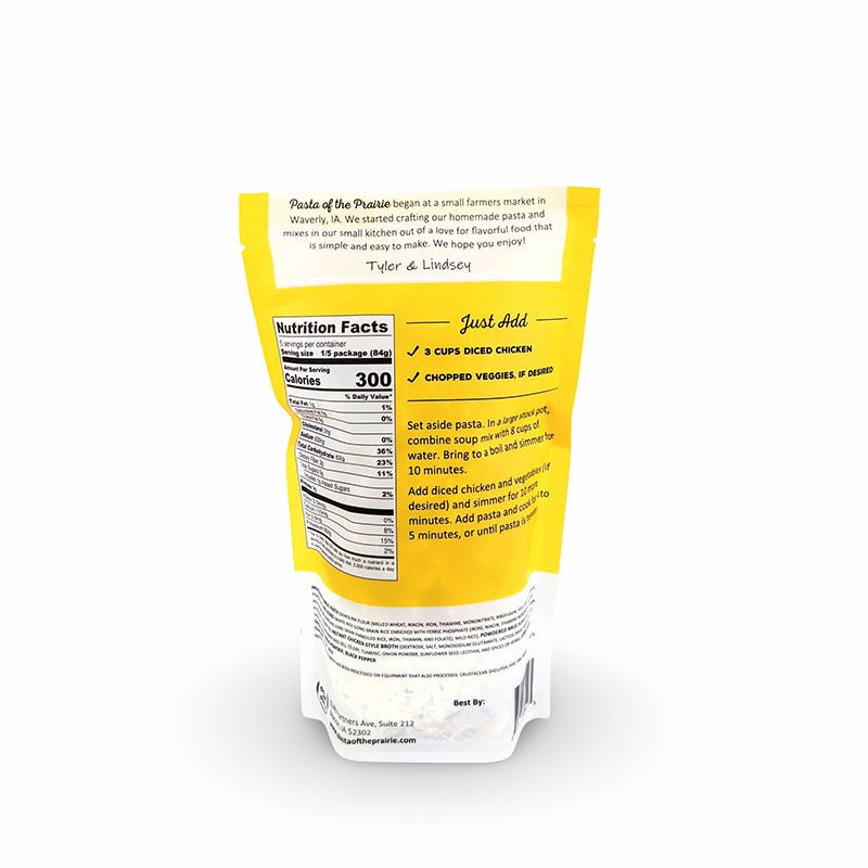 Back view of creamy chicken and rice soup mix packaging with nutritional information on a white background