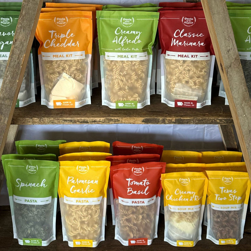 Pasta of the Prairie packages displayed on shelves